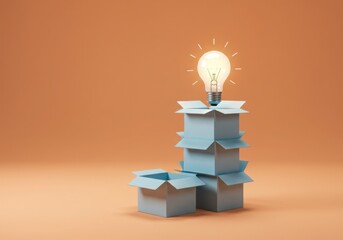 Light bulb glowing atop a stack of blue boxes against an orange background space