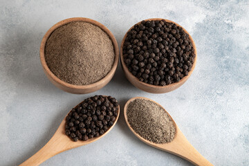 Ground black pepper with grains of black pepper top view