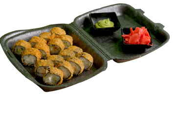 Open foam container with fried sushi rolls, wasabi, and pickled ginger on a white background. Cropped PNG object.