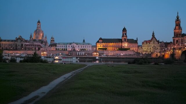 Dresden skyline at blue hour featuring the illuminated Frauenkirche, historic buildings, and waterfront reflections along the Elbe River, capturing the charm of Saxony&rsquo;s cultural heart.