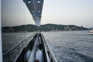 City and sea view from a boat on the Bosphorus with reflection from the glass wide angle