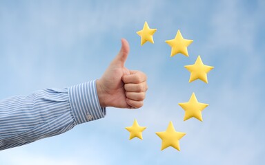 Hand gives a thumbs up with floating yellow stars, conveying a positive review or excellent rating against a soft blue sky