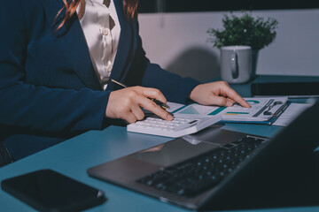 Expert woman asian female people review data number costing managerial account prepare monthly...
