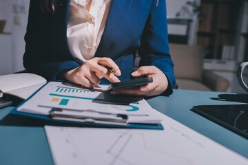 Expert woman asian female people review data number costing managerial account prepare monthly...