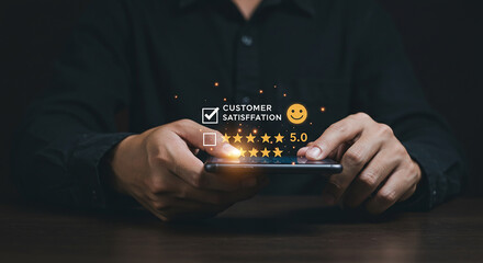 Person holding a tablet with a security shield and various digital icons floating above it in dark setting