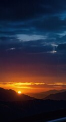 Obraz premium Rainy Sunset over Majestic Mountains