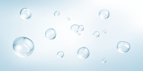 Transparent drops isolated on light blue background. Clear bubbles design elements.