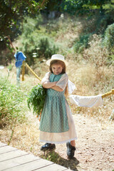 little cute girl on a farm in summer