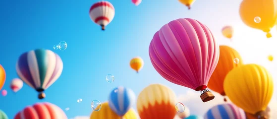 Poster Colorful hot air balloons floating in a clear blue sky.