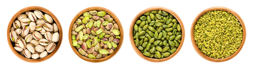 Pistachios in wooden bowls. From left to right unshelled and shelled roasted pistachios, whole and chopped raw pistachio seeds. A flavorful snack and versatile ingredient. Isolated, from above. Photo