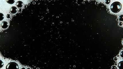 Bubbles with foam, and black background.