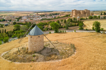 Aerial view of an old windmill near historic Castle of Belmonte in Spain.
