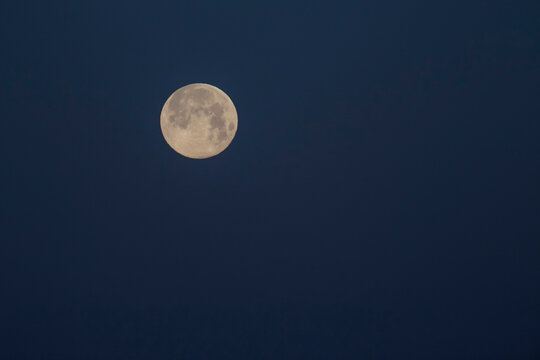 view on full Moon in dark blue night sky