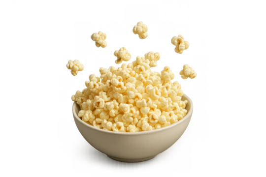 Bowl overflowing with freshly popped popcorn on transparent background