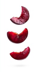 Vibrant Plum Slices Floating on White Background