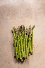 Bunch of fresh green asparagus on stone surface