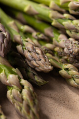 Fresh  green asparagus on stone surface close up
