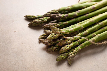 Fresh green asparagus on stone surface vegan food