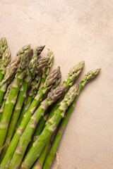 Top view of Fresh green asparagus on stone surface