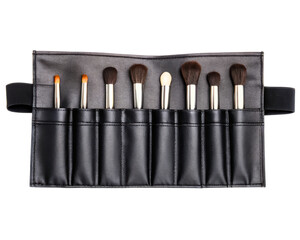Black makeup brush roll with assorted cosmetic brushes on a transparent background