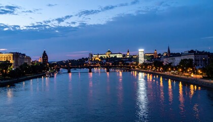Naklejka premium Scenic Cityscape View from Bridge Over River with Reflections at Dusk
