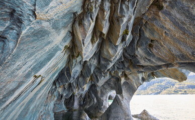 Marble Caves, the most beautiful natural sight in General Carrera Lake in Chile. Surreal rock formations. Curved walls covered in unique patterns. Reflected blue light from turquoise water. Boat tour.