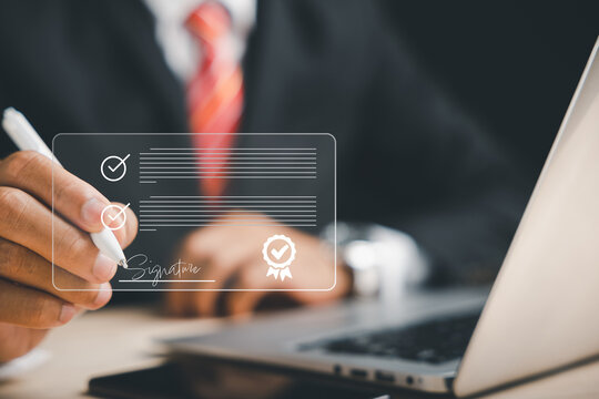 Seamless technology integration Businessman signs electronic documents on virtual screen using pen. Showcases electronic signature concept and efficient online document management.