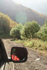 Active senior man enjoying retirement in Georgia: hiking, swimming, picking grapes, buying souvenirs, driving, and playing backgammon. A vibrant and healthy lifestyle in older age