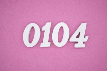 The numbers are made of white painted wood, placed on a pink paper background.