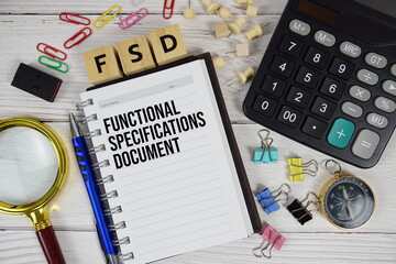 FSD - Functional Specifications Document acronym on notepad, business and financial concept...
