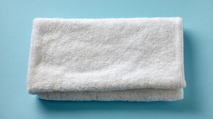 Folded soft terry towel on neutral background top view Realistic fabric texture for spa or home