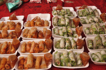 Fresh Vegetable Rice Sheet Roll or fried spring rolls with vegetables lao style for sale laotian people and foreign travelers travel visit in Louangphabang Street Night Market at Luang Prabang, Laos