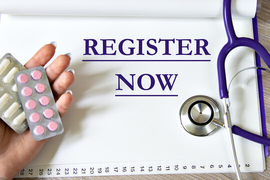 REGISTER NOW - a word on a white sheet of paper against the background of a stethoscope and a woman's hand with pills