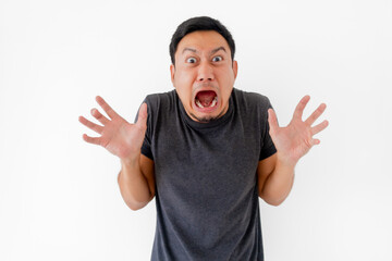 Funny man doing scary face and acting isolated on white background.