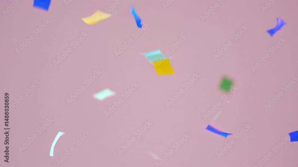 Poster vibrant, shiny confetti floating and gently cascading against luminous pink surface, creating dynami