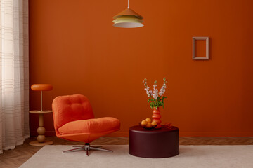 Retro-inspired interior with orange lounge chair, colorful pendant lamp, and sculptural vase. Warm orange walls and playful shapes create a cheerful atmosphere...