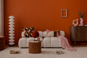 Modern living room with vibrant orange walls, soft cream sofa, geometric pillows, and retro-style decor. A cozy yet playful interior with mid-century vibes.
