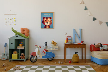 Cute and organized kid room with a checkered playmat, wall art, plush toys, a scooter, and a wooden desk with letters and art supplies.