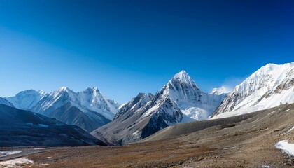 serene mountain peaks under a clear blue sky