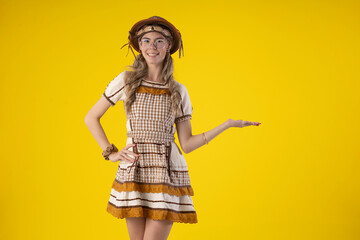 Young woman wearing typical June festival clothes and wearing a leather or straw hat and glasses