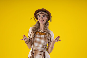 Young woman wearing typical June festival clothes and wearing a leather or straw hat and glasses