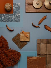 Rustic and modern material mix with terracotta, blue hues, and brass details, creating a warm color...