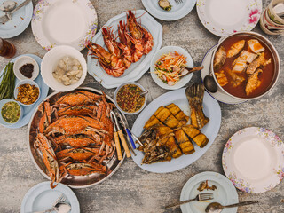Top view of traditional Thai seafood dishes on table