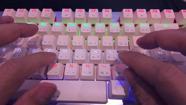 Hands typing quickly on a keyboard, with clear keys and fast movements. Perfect for content related to work, education, technology, and digital communication. Ideal for office videos, online learning,
