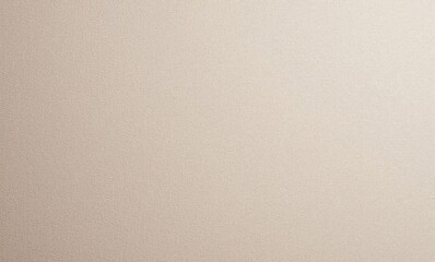 Close-up of a textured beige wall surface with subtle shadows and light.