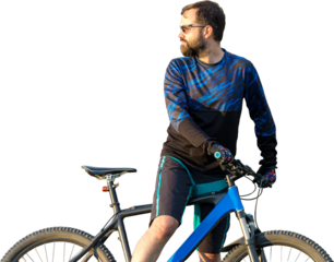 Cyclist in pants and fleece jacket on a modern carbon hardtail bike with an air suspension fork rides off-road. The guy is resting on a stump in the park, looks into the distance.