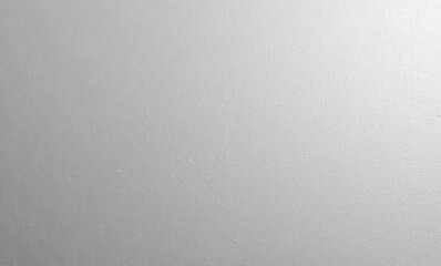 Textured gray surface with subtle variations and a matte finish.