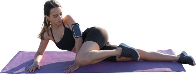 A young slim athletic girl in sportswear with snakeskin prints performs a set of exercises. Fitness and healthy lifestyle.