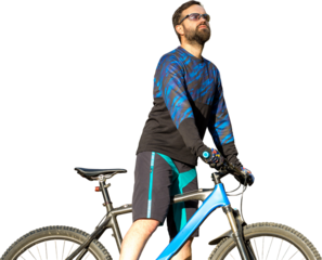 Cyclist in shorts and jersey on a modern carbon hardtail bike with an air suspension fork standing on a cliff against the background of fresh green spring forest