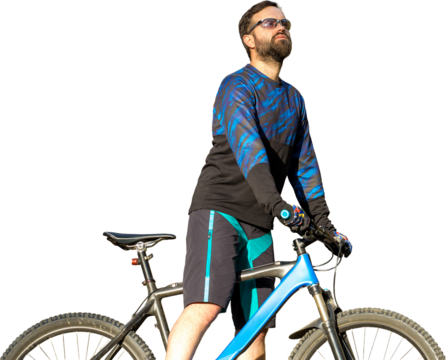 Cyclist in shorts and jersey on a modern carbon hardtail bike with an air suspension fork standing on a cliff against the background of fresh green spring forest